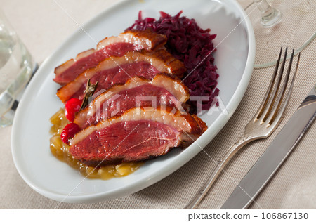 Duck breast Magret with stewed cabbage 106867130
