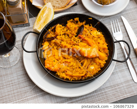 Just cooked paella de marisco on table 106867329