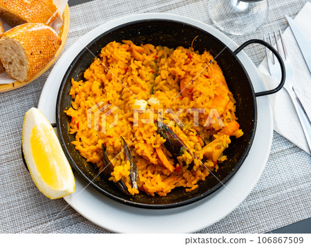 Paella de marisco, served on plate Paella de marisco, served on plate 106867509