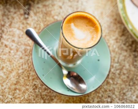 Coffee cortado and on the wooden table 106868022