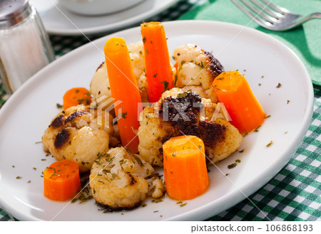 Vegetarian dish with cauliflower and carrot 106868193