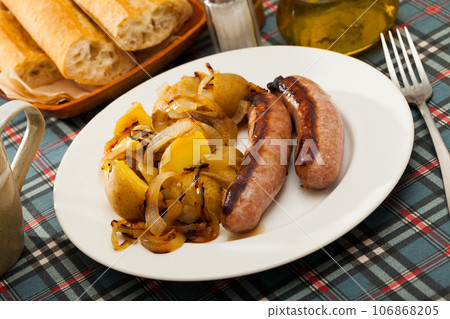 Grilled sausages with potatoes Grilled sausages with potatoes 106868205