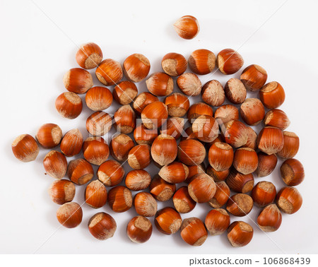 Top view of pile of filberts on white Top view of pile of filberts on white 106868439