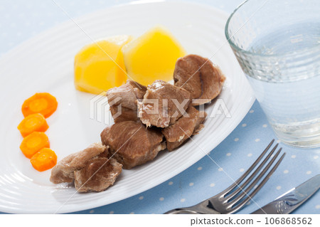 Cooked on steam turkey, served with potatoes and carrots, diet food Cooked on steam turkey, served with potatoes and carrots, diet food 106868562
