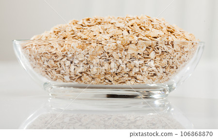 Glass bowl with oats Glass bowl with oats 106868870