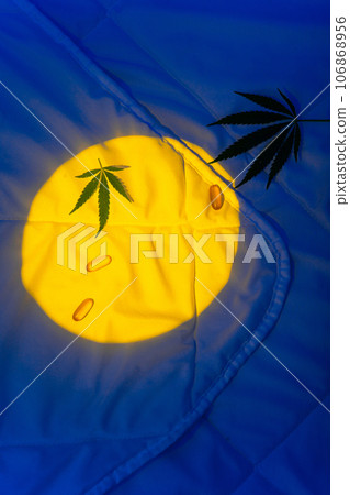 Background for cannabis product to sleep Light of moon on blanket with marijuana 106868956
