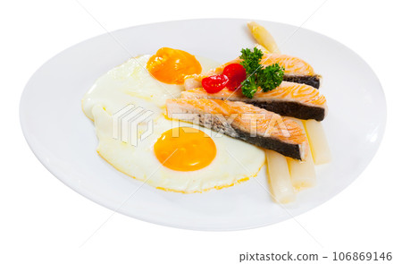 Fried salmon with scrambled eggs and asparagus 106869146