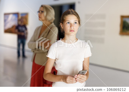 Teenage girl visiting museum Teenage girl visiting museum 106869212