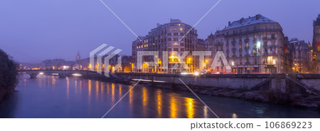 Image of night light of Grenoble near river in France 106869223