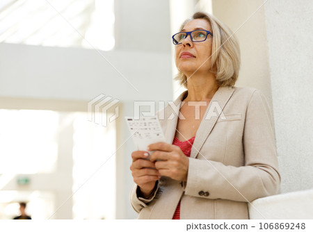 Mature woman visiting museum 106869248