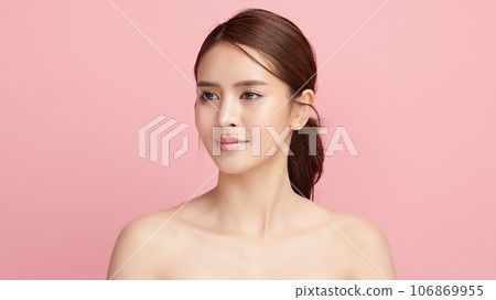 Beautiful young asian woman with clean fresh skin on pink background, Face care, Facial treatment, Cosmetology, beauty and spa, Asian women portrait. Beautiful young asian woman with clean fresh skin on pink background, Face care, Facial treatment, Cosmetology, beauty and spa, Asian women portrait. 106869955