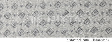 Gray and white fabric with geometric ornament. Gray and white fabric with geometric ornament. 106870347