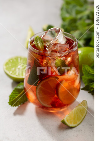 Cocktail Cuba Libre with rum, cola, mint, and lime. 106872826