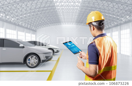 Asian engineer or technician work with ev car Asian engineer or technician work with ev car 106873226