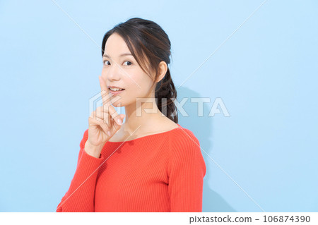 A woman posing for a secret conversation A woman posing for a secret conversation 106874390