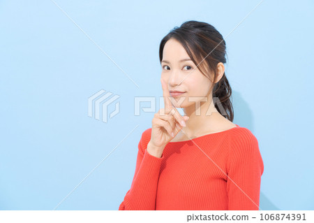 A woman posing for a secret conversation A woman posing for a secret conversation 106874391