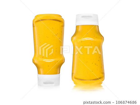 Bottle of classic hot dog and fries mustard sauce on white background. Bottle of classic hot dog and fries mustard sauce on white background. 106874686