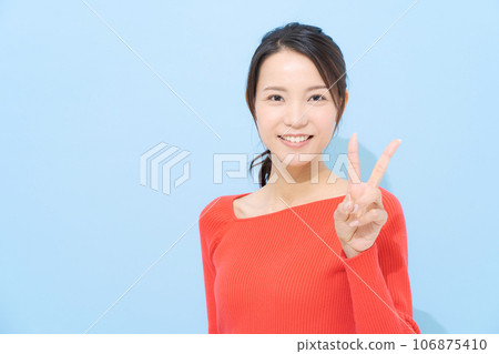 woman doing peace sign woman doing peace sign 106875410