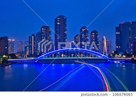 Eitaibashi Bridge, the light traces of houseboats, and the skyscraper apartment complex seen from the Sumida River Ohashi Bridge Eitaibashi Bridge, the light traces of houseboats, and the skyscraper apartment complex seen from the Sumida River Ohashi Bridge 106876065
