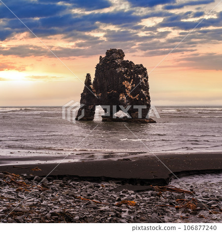 The drinking elephant or rhinoceros, basalt stack Hvitserkur along the eastern shore of Vatnsnes peninsula, in northwest Iceland. Awesome rock structure made from basalt and standing 15 metres tall. The drinking elephant or rhinoceros, basalt stack Hvitserkur along the eastern shore of Vatnsnes peninsula, in northwest Iceland. Awesome rock structure made from basalt and standing 15 metres tall. 106877240