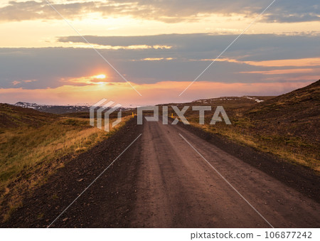 View during auto trip in West Iceland highlands, Snaefellsnes peninsula, Snaefellsjokull National Park. Spectacular volcanic tundra landscape with mountains, craters, lakes, gravel roads. View during auto trip in West Iceland highlands, Snaefellsnes peninsula, Snaefellsjokull National Park. Spectacular volcanic tundra landscape with mountains, craters, lakes, gravel roads. 106877242