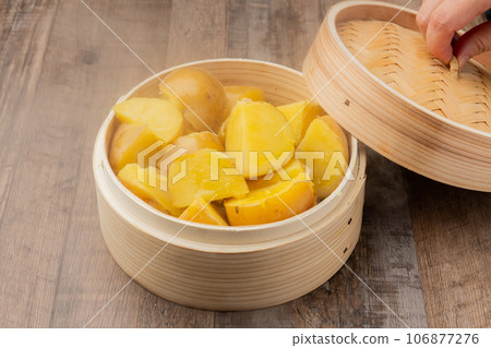 Fluffy sweet potato, open lid Fluffy sweet potato, open lid 106877276