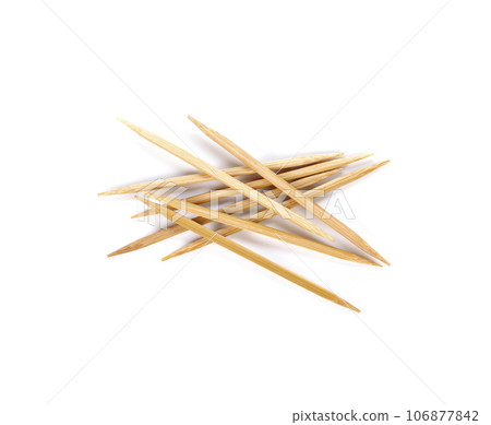 Wooden toothpicks isolated on white background. Wooden toothpicks isolated on white background. 106877842