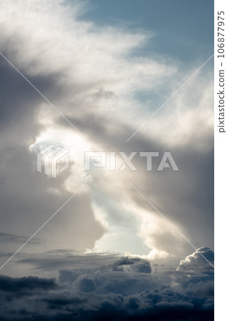 Dramatic sky with grey clouds over the city before the storm. Weather before or after a storm. 106877975