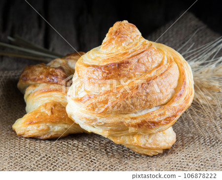 Tasty croissants on wooden background. Tasty croissants on wooden background. 106878222