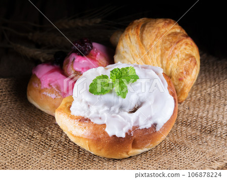 Various types of bread on wooden 106878224