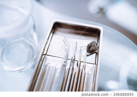 A set of sterile dental instruments for dental treatment. Dental care for people. 106880895