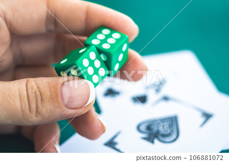Playing dice in woman hand Playing dice in woman hand 106881072
