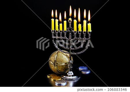 Hanukkah flames kindling hanukkiah menorah candles during jewish holy holiday Hanukkah flames kindling hanukkiah menorah candles during jewish holy holiday 106883346
