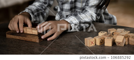 hands kid playing the wooden block game is a way to learn, and develop a way of thinking about concepts, potential and the brain hands kid playing the wooden block game is a way to learn, and develop a way of thinking about concepts, potential and the brain 106885292