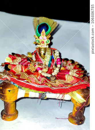 Lord Krishna also known as laddu gopal sculpture in beautiful clothes selective focus Lord Krishna also known as laddu gopal sculpture in beautiful clothes selective focus 106886785