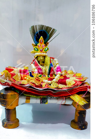 Lord Krishna also known as laddu gopal sculpture in beautiful clothes selective focus Lord Krishna also known as laddu gopal sculpture in beautiful clothes selective focus 106886786