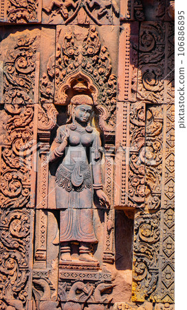 Mysterious Ancient ruins Banteay Srei temple - famous Cambodian landmark, Angkor Wat complex of temples. Siem Reap, Cambodia. Mysterious Ancient ruins Banteay Srei temple - famous Cambodian landmark, Angkor Wat complex of temples. Siem Reap, Cambodia. 106886895