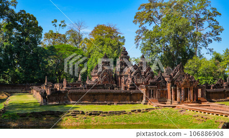 Mysterious Ancient ruins Banteay Srei temple - famous Cambodian landmark, Angkor Wat complex of temples. Siem Reap, Cambodia. Mysterious Ancient ruins Banteay Srei temple - famous Cambodian landmark, Angkor Wat complex of temples. Siem Reap, Cambodia. 106886908