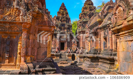 Mysterious Ancient ruins Banteay Srei temple - famous Cambodian landmark, Angkor Wat complex of temples. Siem Reap, Cambodia. Mysterious Ancient ruins Banteay Srei temple - famous Cambodian landmark, Angkor Wat complex of temples. Siem Reap, Cambodia. 106886909