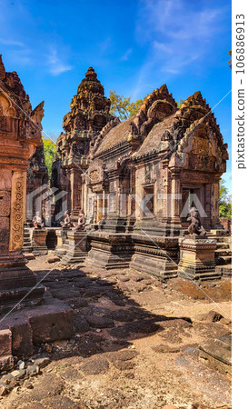 Mysterious Ancient ruins Banteay Srei temple - famous Cambodian landmark, Angkor Wat complex of temples. Siem Reap, Cambodia. Mysterious Ancient ruins Banteay Srei temple - famous Cambodian landmark, Angkor Wat complex of temples. Siem Reap, Cambodia. 106886913