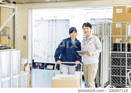 Female staff working in the warehouse 106887128