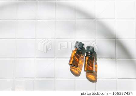 Two aroma oil bottles. An image of nature, organic, and beauty. 106887424