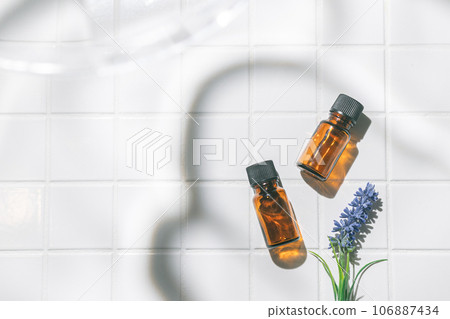 Two aroma oil bottles. An image of nature, organic, and beauty. 106887434