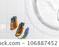 Two aroma oil bottles. An image of nature, organic, and beauty. 106887452