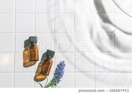 Two aroma oil bottles. An image of nature, organic, and beauty. 106887453