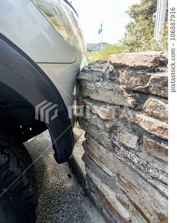 Automobile that bumped into a wall when parking Automobile that bumped into a wall when parking 106887916