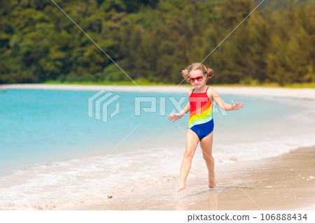 Kids playing on beach. Children play at sea. 106888434