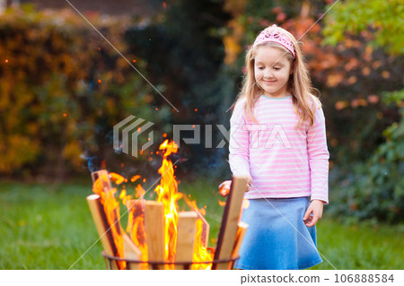 Child with smores at fire. Kids roast marshmallow. Child with smores at fire. Kids roast marshmallow. 106888584