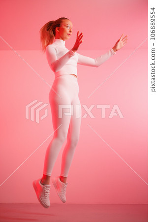 Female in smartglasses gesturing in mid-air 106889554