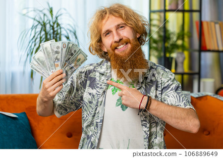 Successful happy rich business man counting money cheering up with high profits, lottery game win Successful happy rich business man counting money cheering up with high profits, lottery game win 106889649
